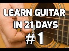 a hand holding an acoustic guitar with the words learn guitar in 21 days 1 on it