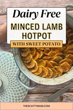 a bowl filled with baked potato chips on top of a wooden table next to a knife