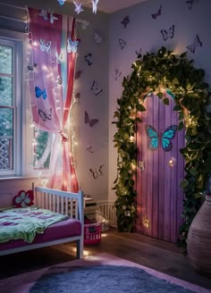 a bedroom decorated in pink and green with butterflies on the wall