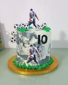 a soccer themed birthday cake with an image of a player on it and the number 10