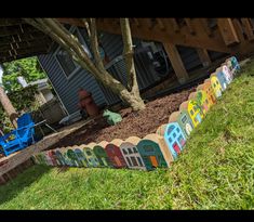 a colorful garden wall in front of a house