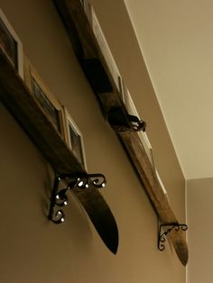 there are two knives hanging on the wall