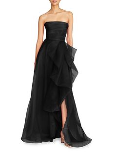 Crafted from layers of vibrant tulle, this strapless gown features an elegant ruffled front. Strapless Concealed back zip Seamed waist Cascading front drape Front slit Pooled hem 100% polyester Dry clean Imported SIZE  FIT Measurements are taken from a US size 2 About 61.5 from topline to hem Model measurements: 510 tall, 31 bust, 27 waist Model is wearing US size 4 Please Note: Compared to the Brand's Size Guide, this style measures true to size. ABOUT THE BRAND Black Strapless Evening Gown, Dream Dresses, Evening Dress Fashion, Simple Dress, Strapless Maxi, Strapless Gown, Tulle Gown, Grad Dresses, Strapless Maxi Dress