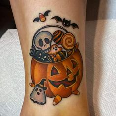 a person with a halloween tattoo on their foot