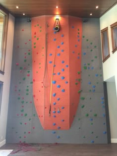 an indoor climbing wall in the shape of a boat