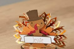 a paper turkey with a name tag on it