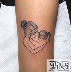 a woman's arm with a tattoo on it that has two girls hugging each other