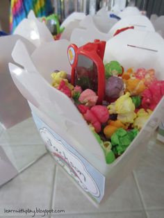 a bag filled with gummy bears sitting on top of a table