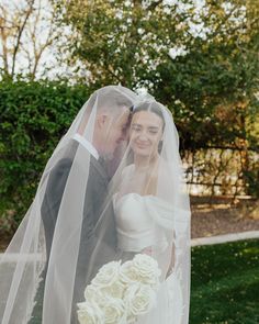 a bride and groom pose for a wedding photo