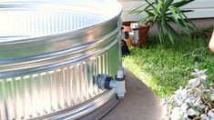 an outdoor hot tub sitting in the grass