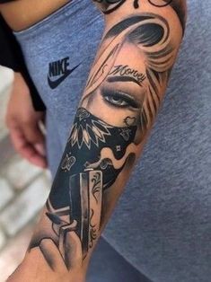 a person with a tattoo on their arm holding a knife and looking at the camera