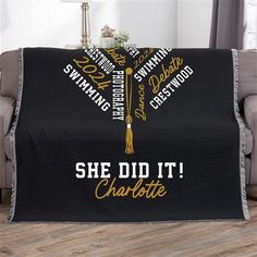 she did it charlotte blanket on couch in living room with grey chair and wooden floor