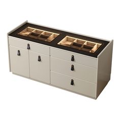 a white cabinet with two drawers and gold trays