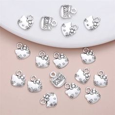 Set Of 24 Small Silver Alloy Charms. 13*10mm. Super Cute. Can Be Used For Any Kind Of Jewelry Making. Bracelets, Necklaces, Earrings. New. Never Used. Will Have A Tracking Number Through Usps. Ships From Pensacola, Fl. Like More From My Shop? Feel Free To Bundle Items Or Let Me Know What You Like, And I Can Bundle For You. Thank You For Your Interest. Sanrio Jewelry, Hello Kitty Charm, Making Bracelets, Pensacola Fl, Womens Jewelry Bracelets, Tracking Number, I Shop, Hello Kitty, Charms