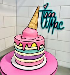 there is a pink cake with an ice cream cone on top that says trippie