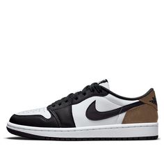 The Air Jordan 1 Low 'Mocha' is a classic colorway that combines a neutral mocha brown upper with white and black accents. The low-top silhouette offers a casual and versatile look, making it a popular choice for both on-court and off-court wear. This sneaker is known for its clean design, comfortable fit, and timeless appeal. Jordan 1 Low Mocha, Low Jordan 1, Jordan Ones, Low Air Jordan 1, Mocha Brown, Air Jordan 1 Low, Jordan 1 Low, Black Accents, Stylish Sneakers