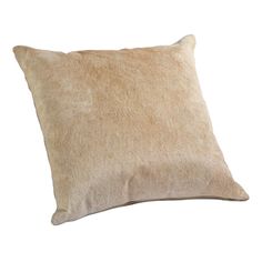 a brown and white pillow on a white background