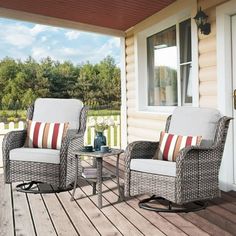 two chairs and a table on a porch