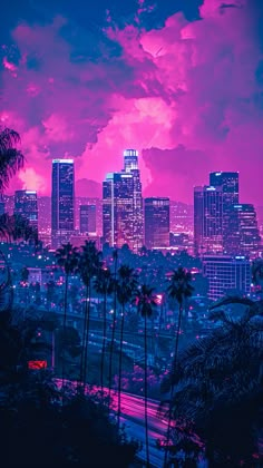 the city skyline is lit up in pink and purple colors with palm trees on either side