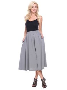 Strut or twirl with confidence in this light and breezy flared skirt. Perfect for keeping cool on a hot summer's day or for adding a touch of style whether you're off to work or a night on the town, this polyester and spandex skirt is as versatile as it is alluring. Simply hand wash your skirt to keep it looking new longer. Spring A-line Bottoms With Elastic Waistband, Spring Skirt With Wide Waistband, Summer Midi Pleated Skirt, Spring Skirt With Wide Waistband And Stretch, Spring Stretch Skirt With Wide Waistband, Casual A-line Bottoms For Day Out, Summer A-line Bottoms With Elastic Waistband, Chic Flared Skirt With Wide Waistband, Summer A-line Stretch Bottoms