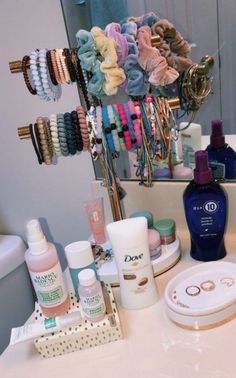 an image of a bathroom vanity with hair products on the counter and in front of it