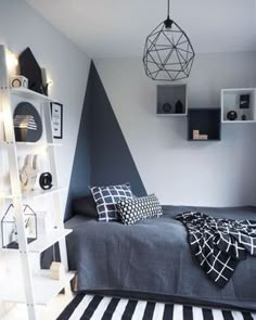 a bed room with a neatly made bed and shelves