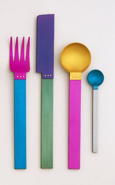 three different colored utensils with spoons and spatulas next to each other