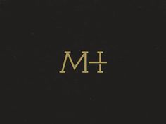 the letter m is shown in gold on black