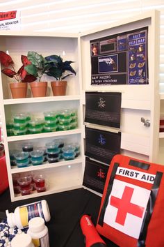 the first aid kit is on display with other medical supplies in front of it,