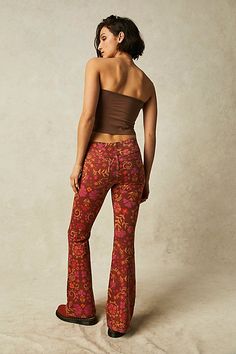 Classic Free People pull-on flares are in a bold boho print featured in a mid-rise with an elastic waistband.* Clean silhouette with a flat front & perfectly placed back pockets* Flare leg* Stretch fabric* Back knee seam detailing Free People Flare Jeans, Bold Boho, Orange Fits, Printed Flare Pants, Boho Jeans, Jeans Free People, All Jeans, Fun Pants, Leg Stretching