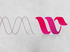 the letters w and m are made up of pink paper with black lines on them