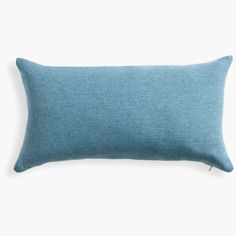 a blue pillow on a white background