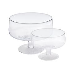 two clear glass dishes sitting side by side on top of each other in front of a white background