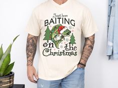 This fun Christmas fishing shirt is a must-have and a perfect gift for the fishing lover in your life,  who wants to celebrate the season with a little bit of humor. Whether you're looking for a unique Christmas gift for a fisherman or a festive addition to your own wardrobe, this shirt is a catch! ⭐Fabric Our Comfort Colors® T-shirts are made with 100% ring-spun cotton with a heavy weight fabric, while the sweatshirts are 80% ring-spun cotton and 20% polyester being a mediumheavy fabric. The te Christmas Fishing, Fishing Christmas, Unique Christmas Gift, Fisherman Gifts, Fun Christmas, Unique Christmas Gifts, Holiday Time, Fishing Shirts, Man Humor