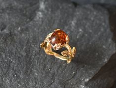 Gold Amber Ring set with a Natural Amber in the highest quality & brownish-yellow translucent resin, at 10x8mm, 3 Carats, sourced from Russia. Gold Leaf Ring made of Gold Vermeil ☞ thickest 18k Gold Plating on top of Solid 925 Sterling Silver ☞ made to last. Matching Earrings & Matching Pendant - please ask me ☞ Choose your size ☞ I resize (before shipping) for FREE to Any size* ⌛Last Ring left ⌛ ❀ Each Natural Gem is unique & will have Slight variations from the product pictures "no two Natural Amber Engagement Ring, Proposal Ring Gold, Gold Leaf Ring, Brownish Yellow, Gold Leaf Rings, Natural Emerald Rings, Gold Flower Ring, Ring Proposal, Emerald Ring Gold