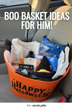 an orange bucket filled with halloween items and the words boo basket ideas for him