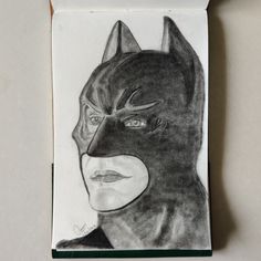 a black and white drawing of a person with a batman mask on it's face