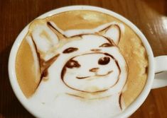 a coffee cup with a drawing of a dog in it's cappuccino