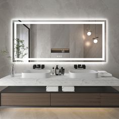 a modern bathroom with two sinks and a large mirror above the sink is illuminated by lights