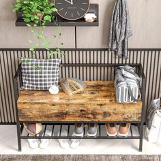 a wooden bench sitting next to a wall filled with plants and shoes on top of it