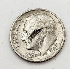 This 1981 Roosevelt Dime is a rare find for collectors. It features a unique error that sets it apart from other coins. It was minted in Philadelphia The coin is a great addition to any collection, especially for those interested in US coins with errors. Its business strike type and unique features make it a valuable addition to any collection. Don't miss out on the opportunity to ow Rare Pennies, Valuable Pennies, Error Coins, Old Coins Worth Money, Rare Coins Worth Money, Us Coins, Coins Worth Money, Coin Worth, Paper Money