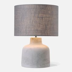 a white table lamp with a grey shade