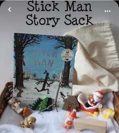 a basket filled with toys and books on top of a table