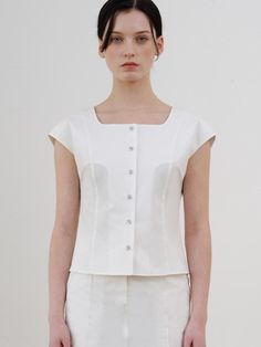 This is a comfortable and trendy top by ourcomos that is made out of high quality cotton and tencel blend fabric. With refined design detail with trendy look, it will stand out from your casual and feminine daily outfit.- Square neckline- Minimal and slim silhouette- Glossy buttons for cool and luxurious mood Fitted Cotton White Tops, Elegant Cotton Top For Workwear, Modern Summer Blouse For Everyday, Modern Summer Blouse For Everyday Wear, Chic Linen Tops For Workwear, Elegant Everyday Linen Tops, White Classic Fitted Top, Classic Everyday Spring Tops, Classic White Fitted Top