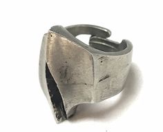 "For your consideration we offer this sculptural statement pewter ring from Norway. This ring is adjustable in size, from a 6 1/2 to a 11. Inside the band is marked \"Pewter\" and \"Norway\". The band is in good condition, it does show some wear revealing the age of this beautiful ring. This pewter ring is easy to adjust making it comfortable to wear. It would also make a great gift to a friend or family member if you are unsure of their ring size. This work of art is truly unique and would make Vintage Adjustable Metal Rings, Vintage Hand Forged Metal Rings, Vintage Silver Hand Cast Ring, Vintage Silver Rings With Hand Cast Design, Vintage Antique Silver Metal Rings, Strange Rings, Pewter Ring, Mid Century Jewelry, Beautiful Ring