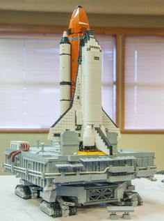 a lego model of a space shuttle on display