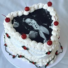 a heart shaped cake with an image of a woman on it