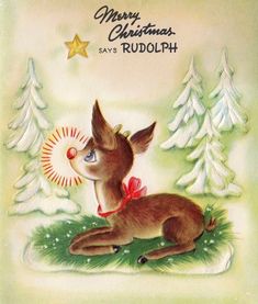 a christmas card with a deer laying in the grass