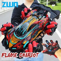 a person wearing gloves and holding a glove with an image of a car on it