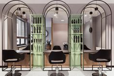 the interior of a salon with mirrors and chairs